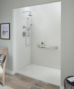 a bathing space that was converted from a tub into a walk-in shower