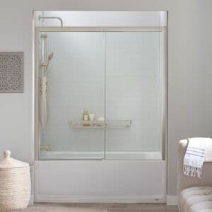a custom tub designed with a surround, on-wall shelf, and glass doors