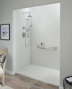 a new shower, customized with on-wall shelving, rainfall showerhead, and white surround