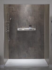 a newly installed custom shower with gray-toned surround