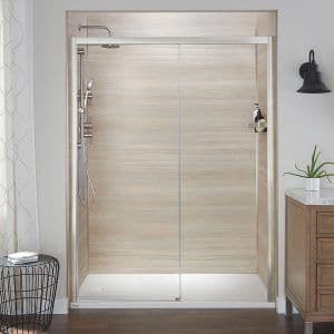 a remodeled shower with tan walls and a rainfall showerhead